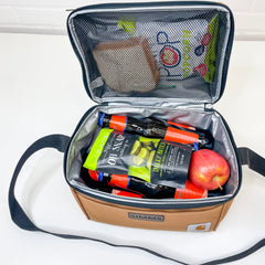Interior of Lunch Box. Top zippered compartment for sandwiches and chips. Shows capacity of six bottles (horizontally) and up to 10-12 oz cans. A lunch packed with sandwich and chips in the top compartment. Drinks, pickles and apple in bottom.
